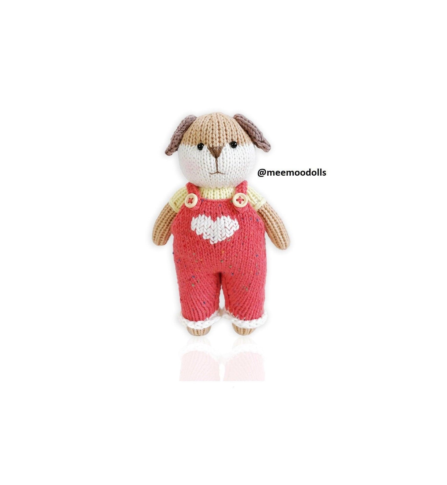 a teddy bear wearing a red coat and hat