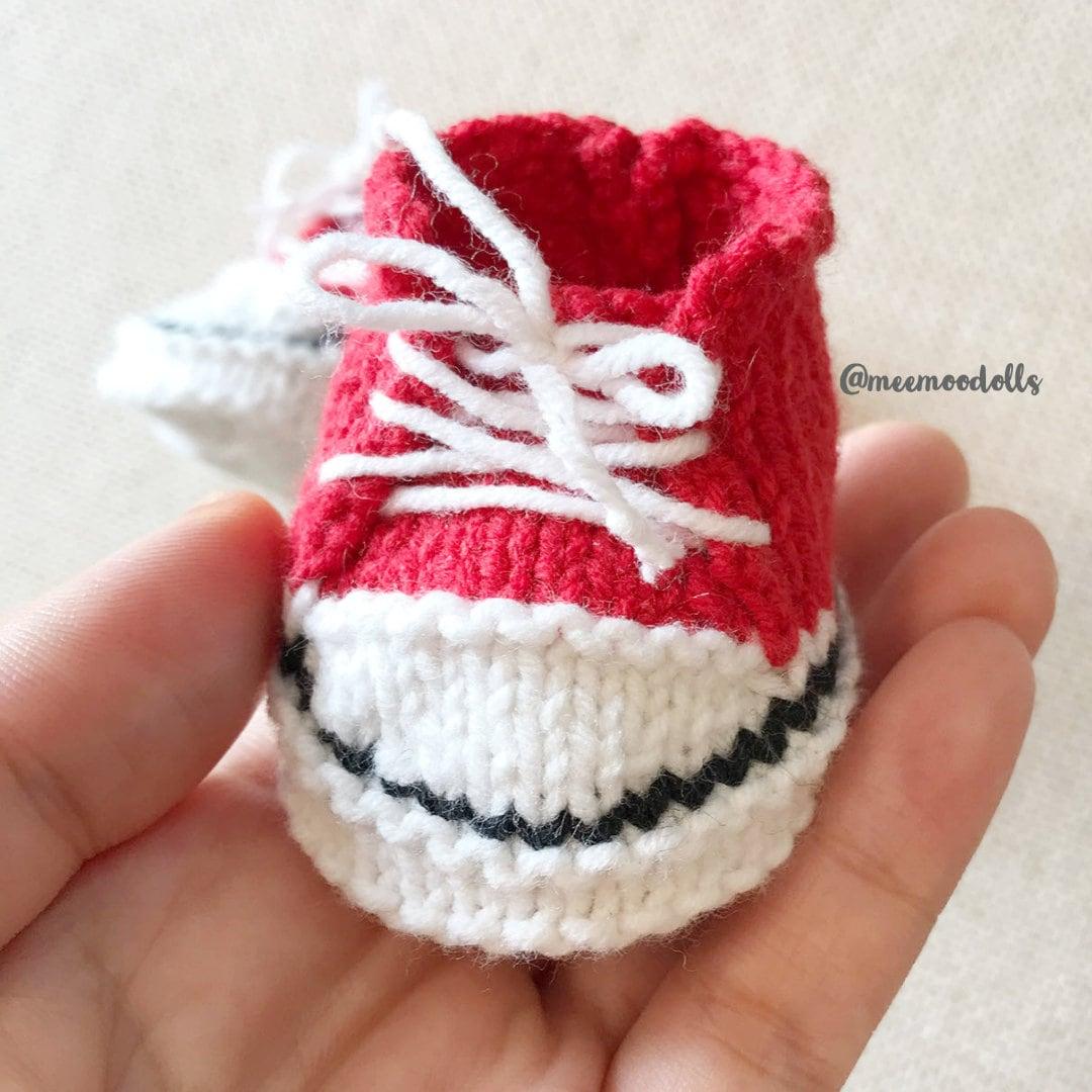 a close up of a person holding a cupcake