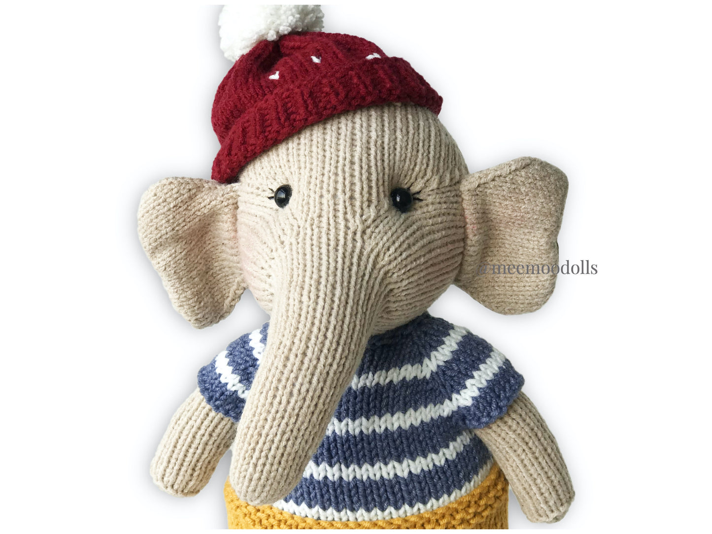 a teddy bear wearing a hat on a table