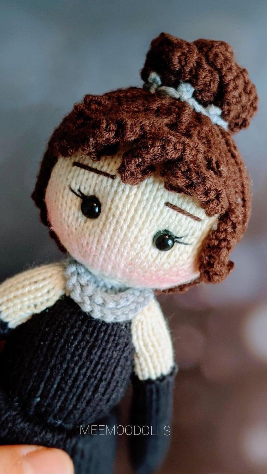 a brown teddy bear wearing a tie and dress shirt