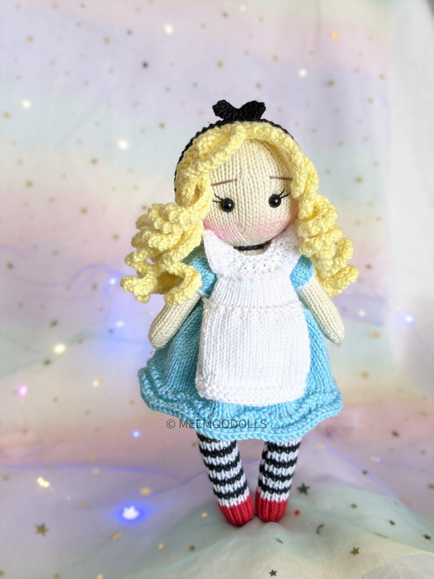a little doll that is sitting on a cake