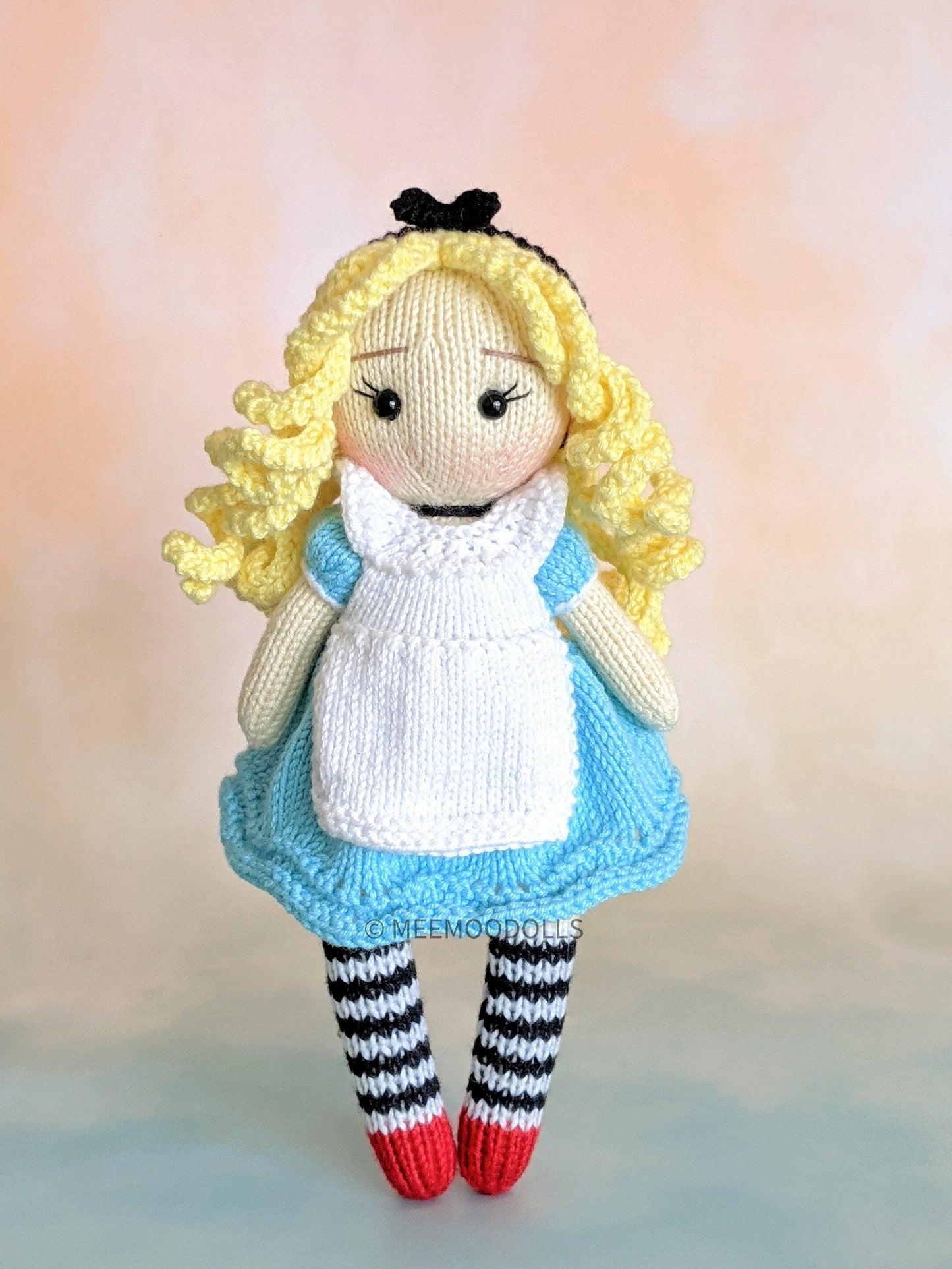 a teddy bear wearing a blue and white outfit