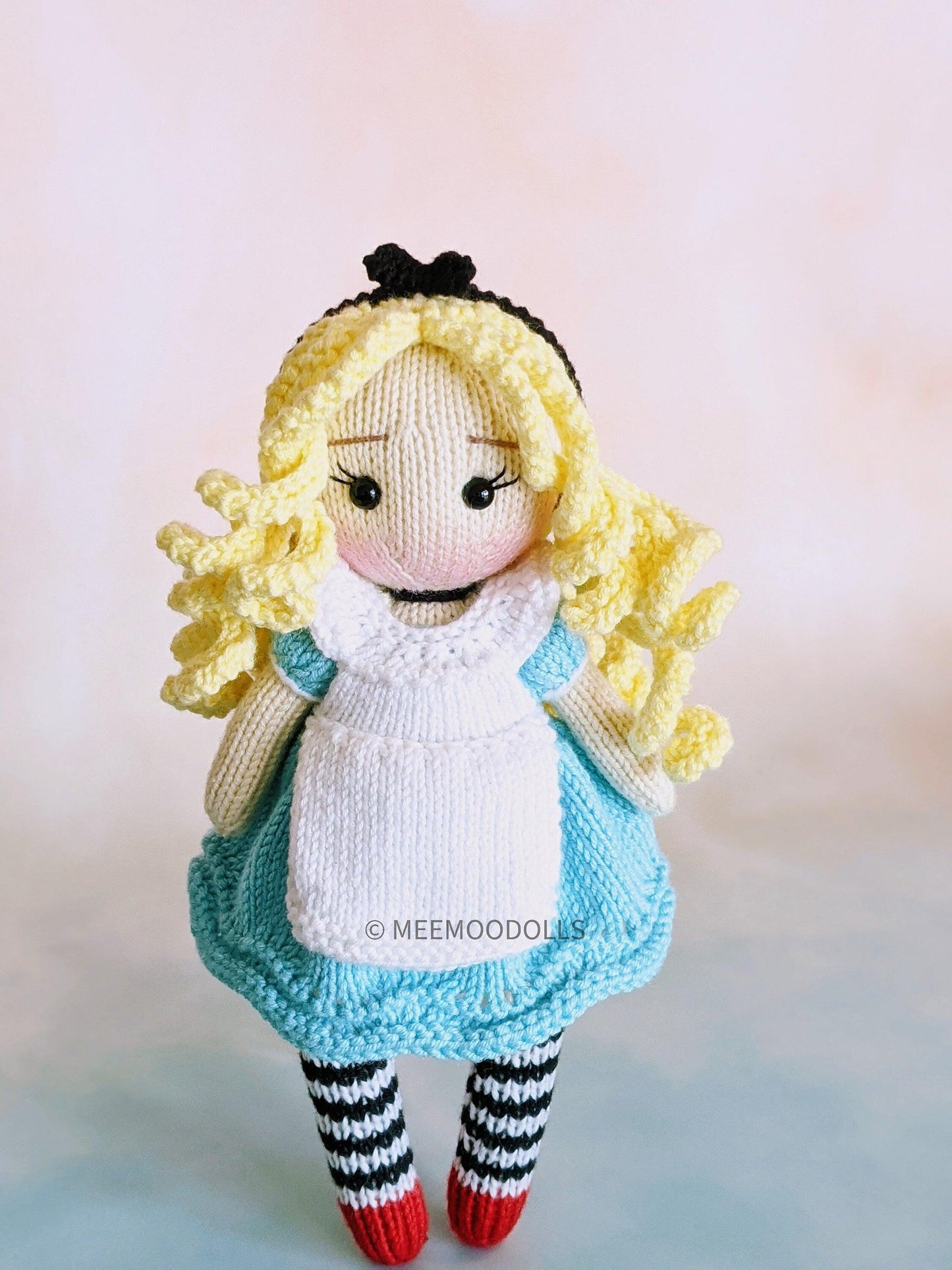 a stuffed animal that is wearing a hat
