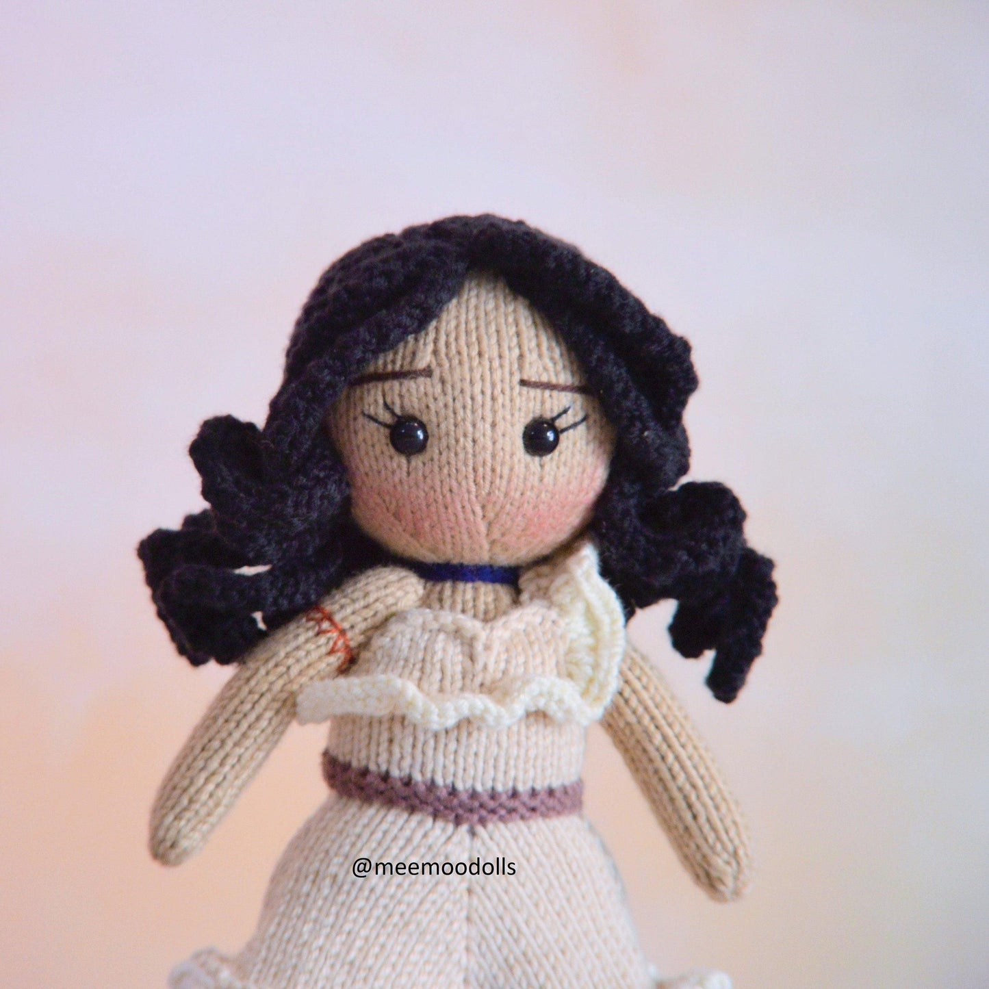 a teddy bear is dressed in a white dress