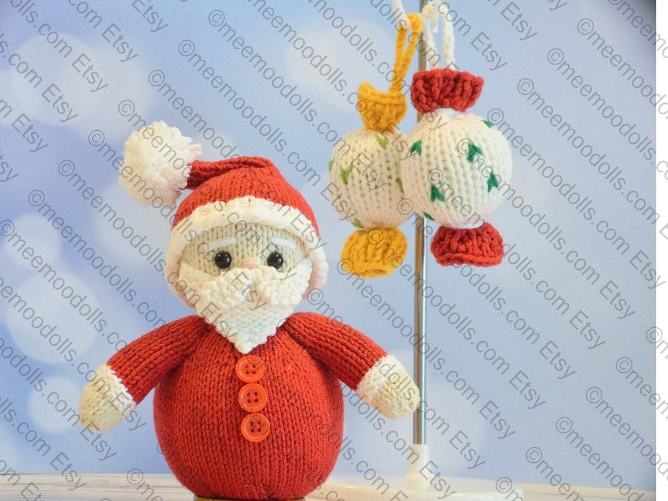a teddy bear with a red bow sitting on a blanket