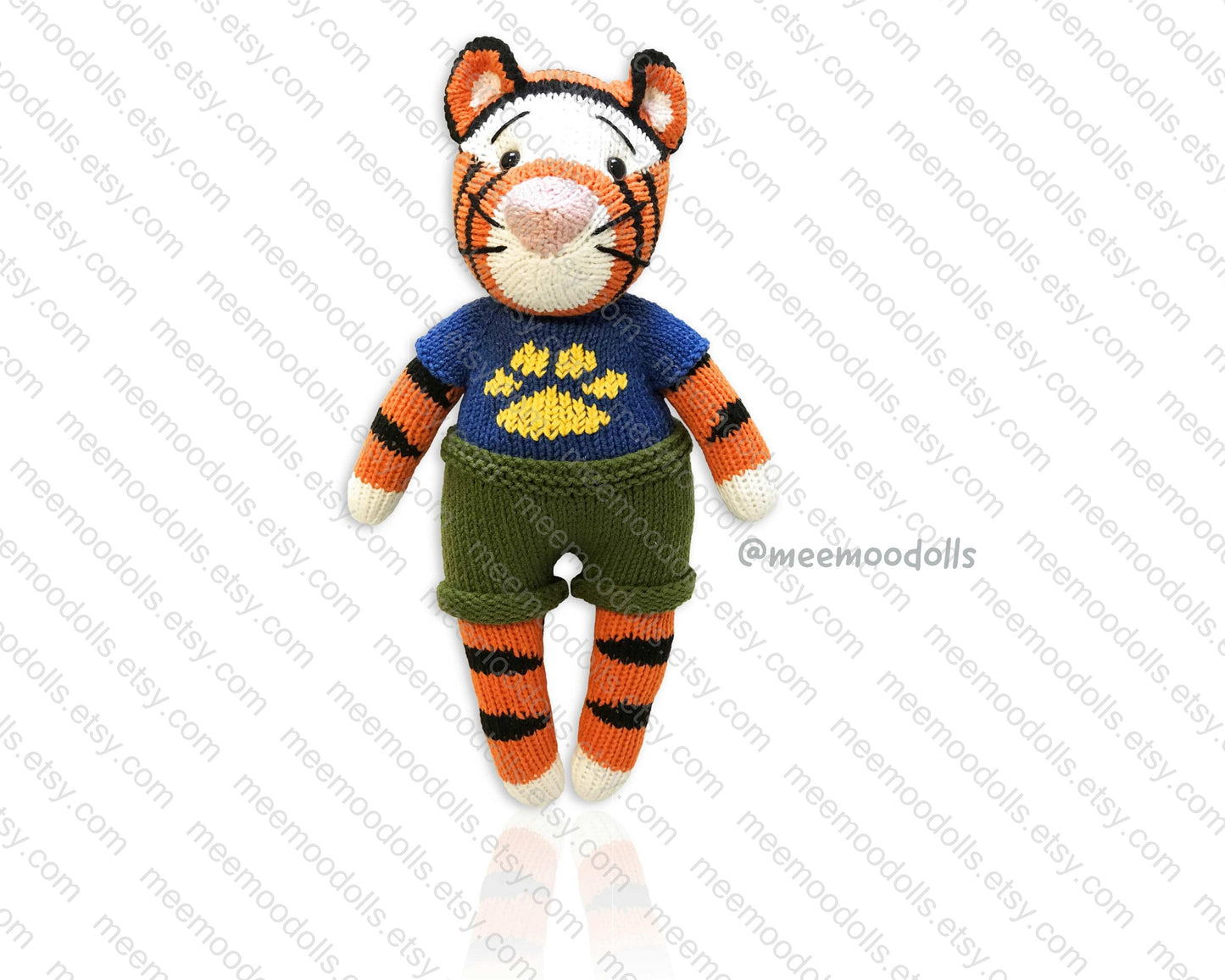 a little boy is holding a stuffed animal