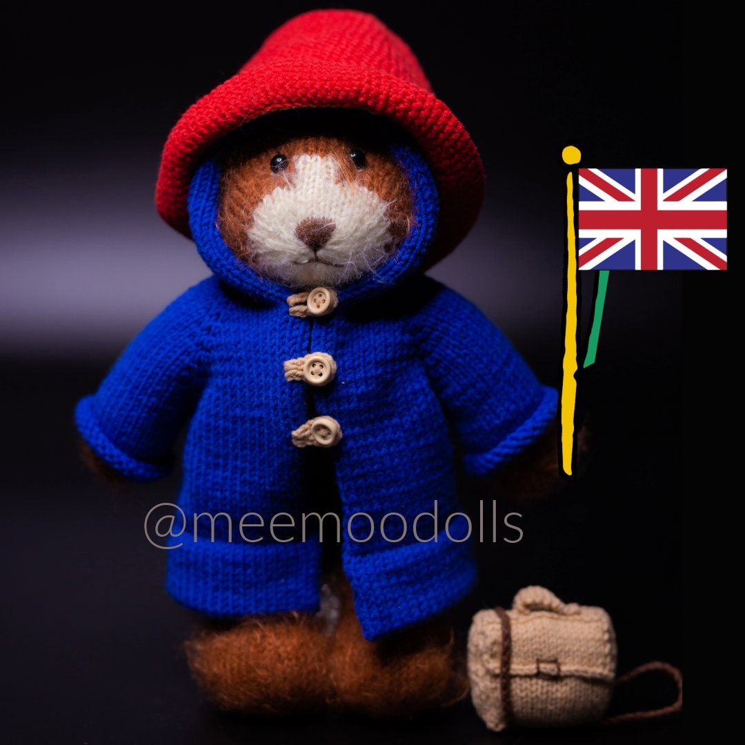a teddy bear wearing a hat and a santa hat