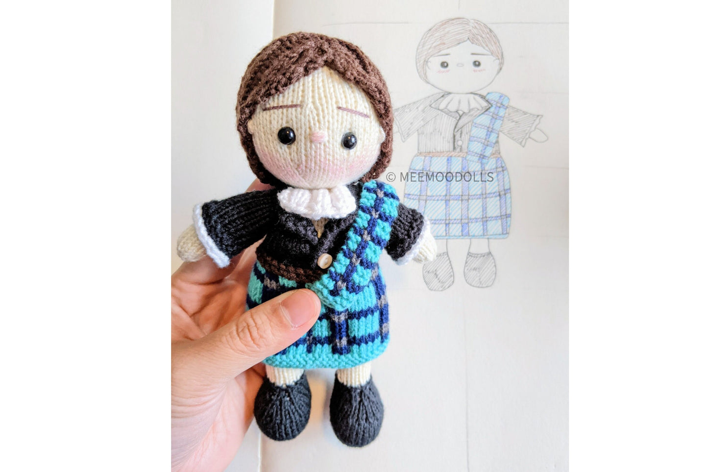 a little boy is holding a teddy bear 