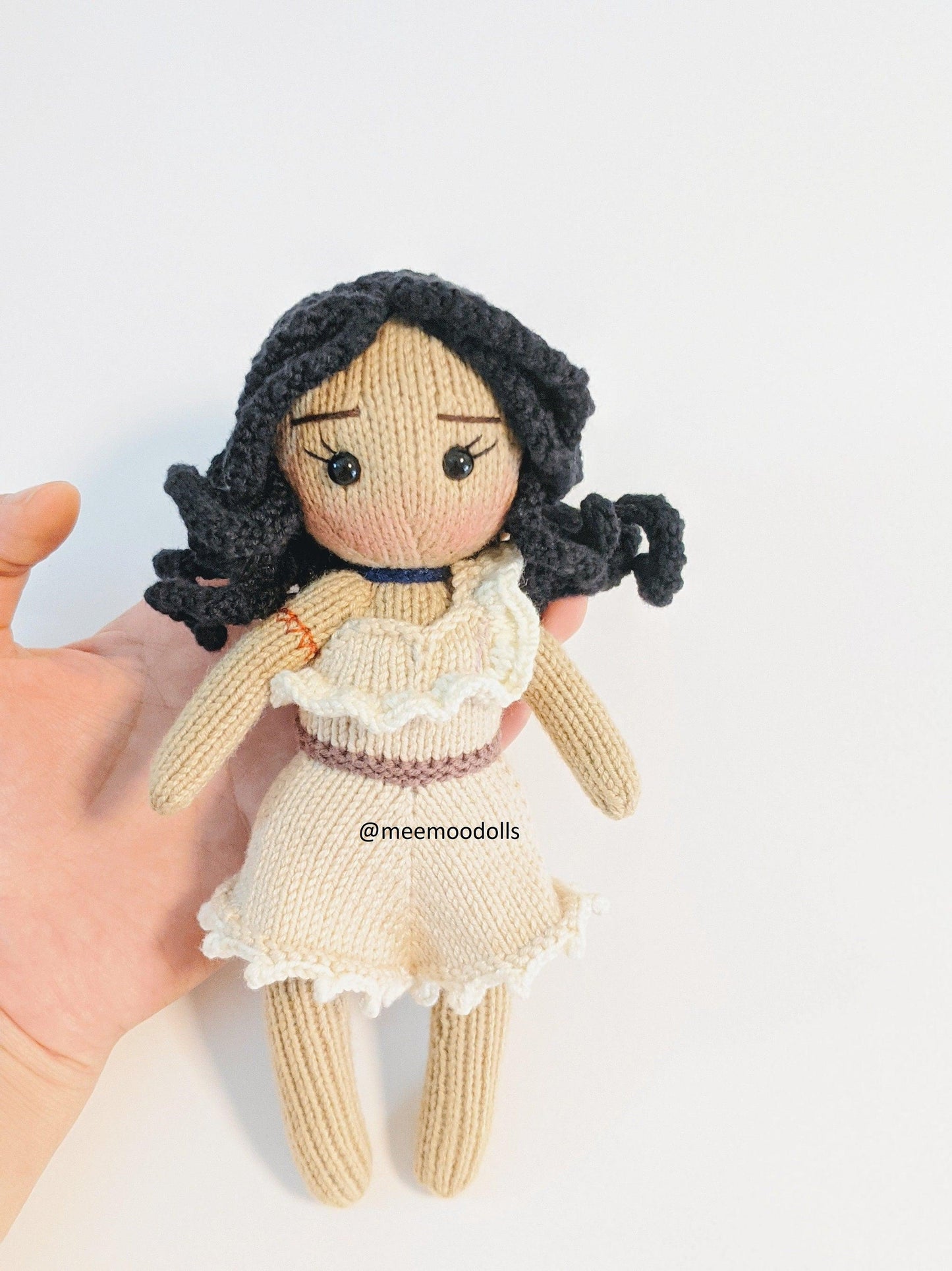 a statue of a woman holding a teddy bear 