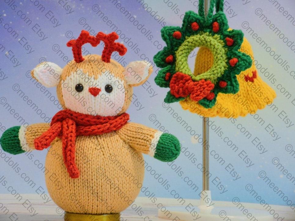 a teddy bear with a santa hat sitting on a blanket 