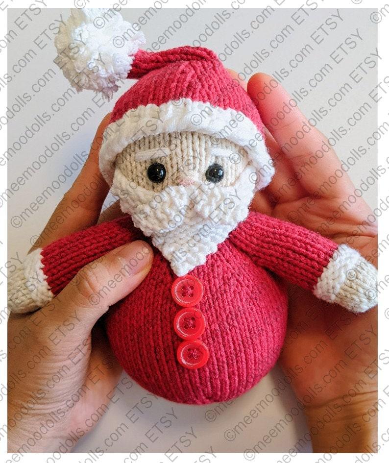 a close up of a teddy bear wearing a santa hat 