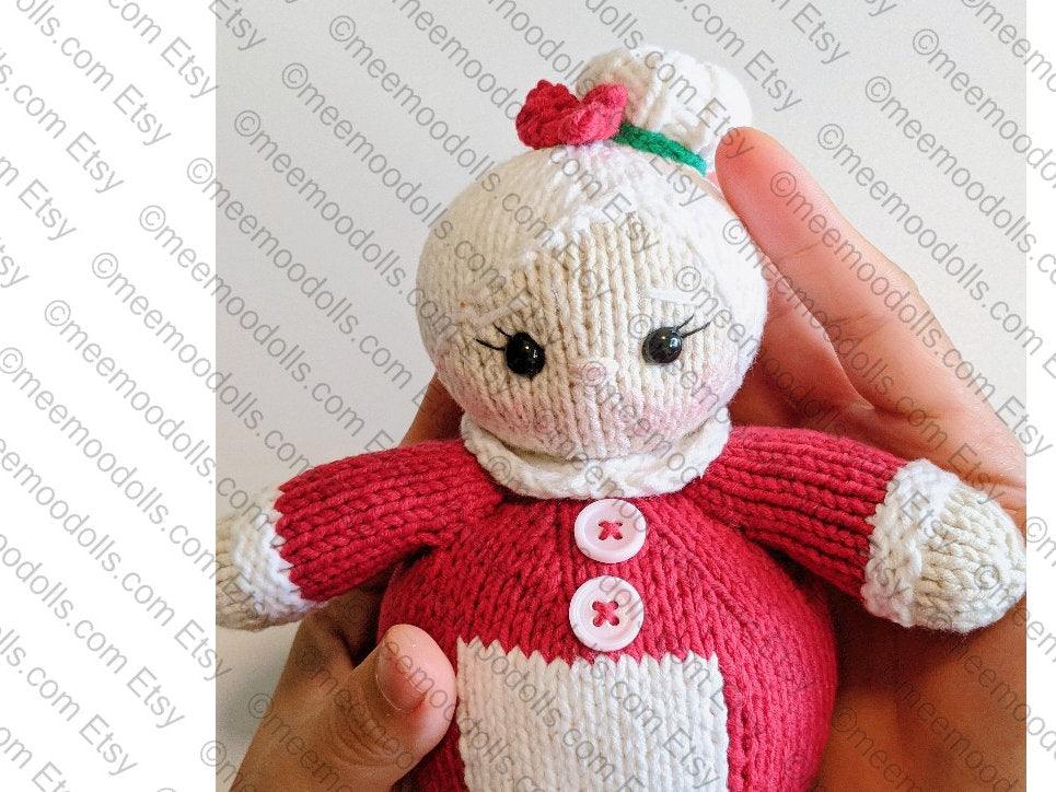 a teddy bear with a red bow on its head 