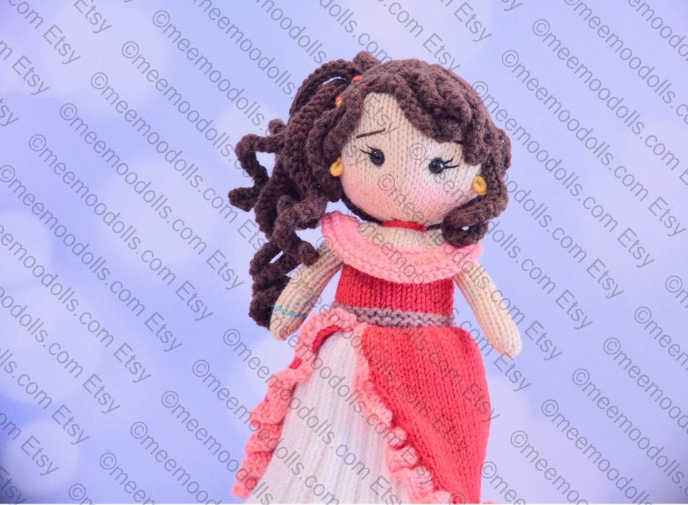 a small teddy bear wearing a pink dress 